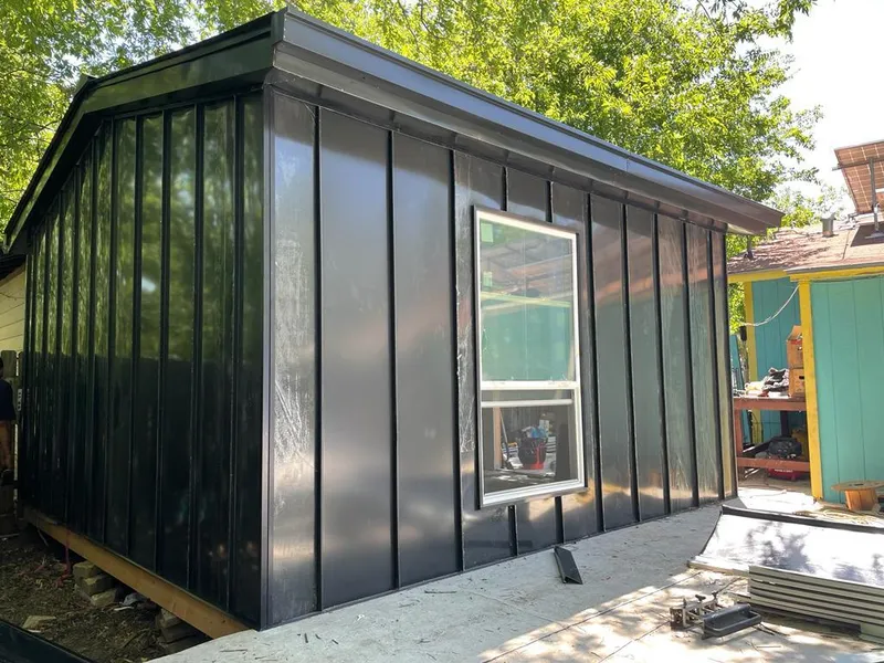 Black standing seam metal wall panels for Roof Inspection in Asbury Lake